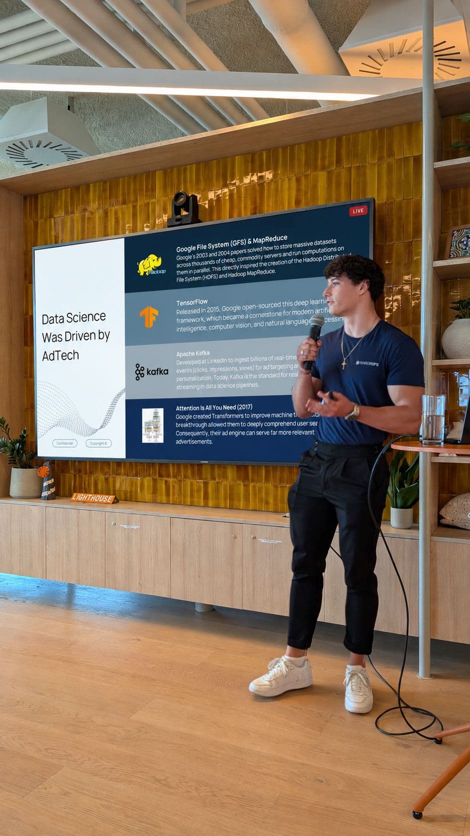 Tiago Santos speaking at a TensorOps event